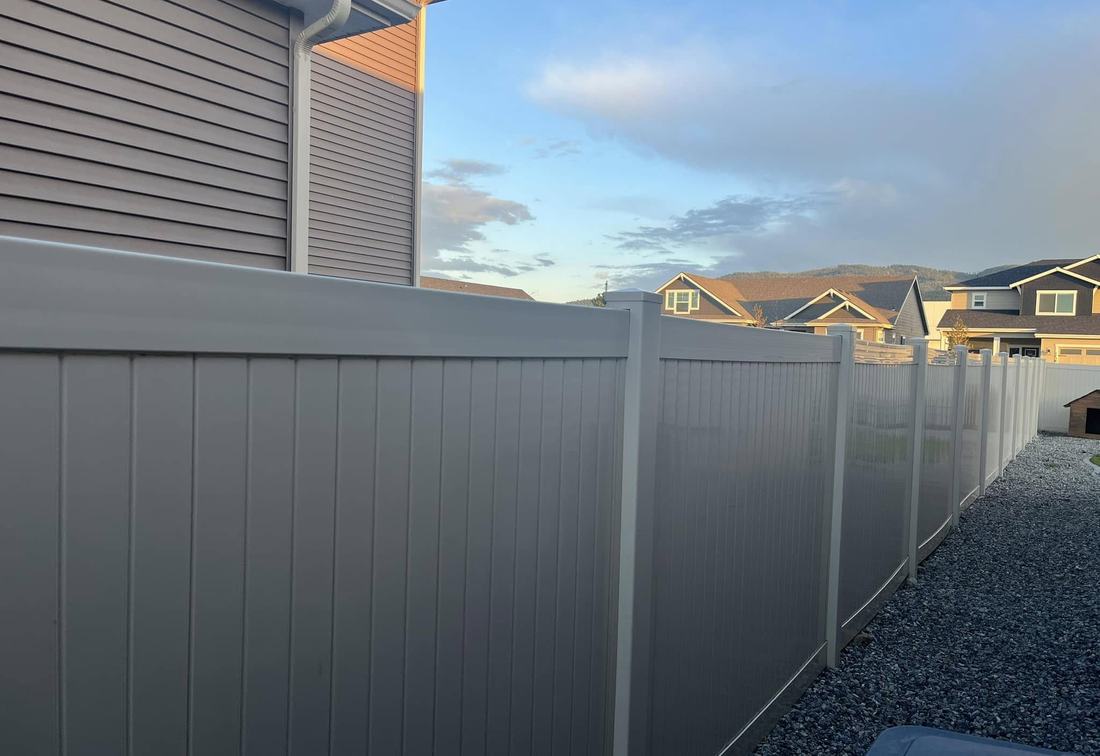 Gray vinyl privacy fence