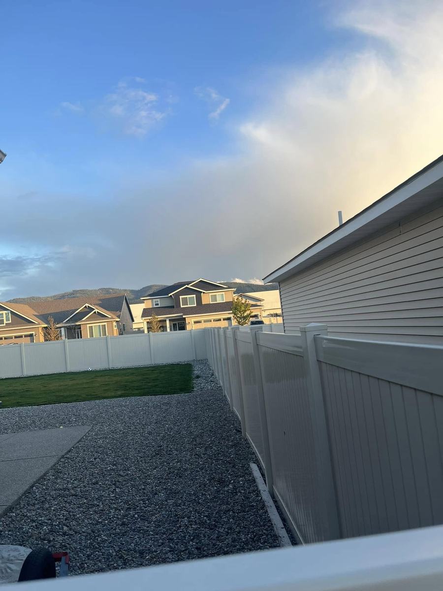Gray vinyl privacy fence in a new neighborhood